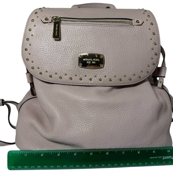 Michael Kors Riley small pebbled leather flap backpack in a light pink color main image 7